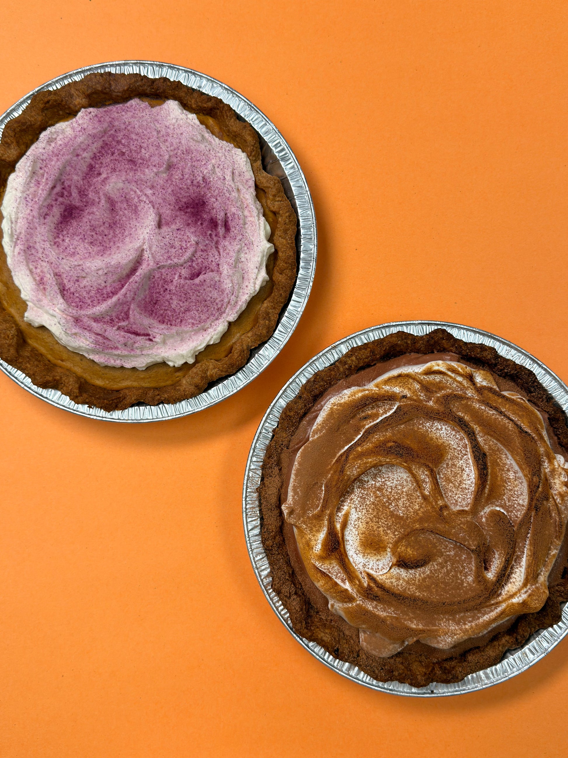 Spiced Ube Kalabasa Pie and Choco Pie on an orange background