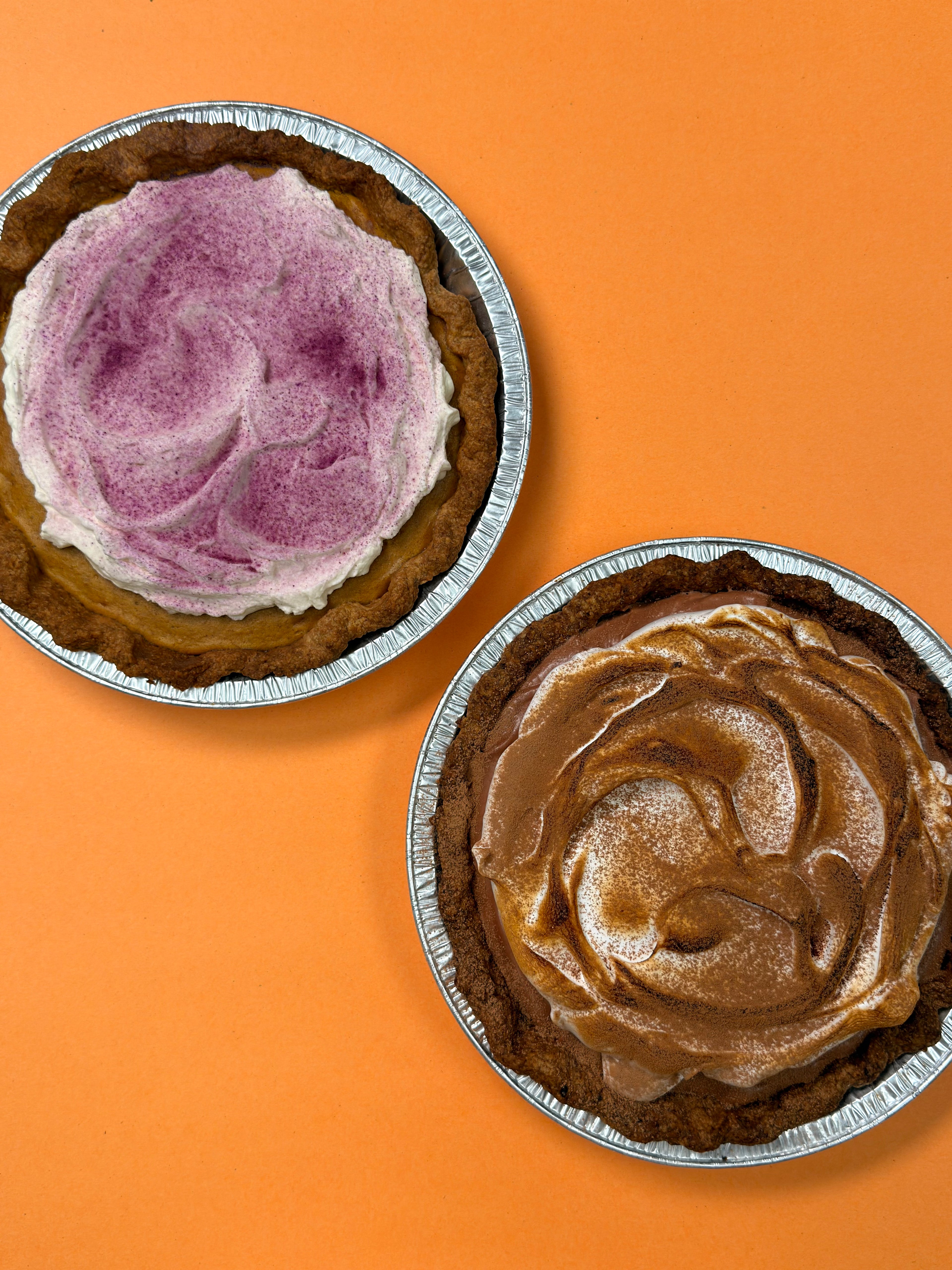 Spiced Ube Kalabasa Pie and Choco Pie on an orange background