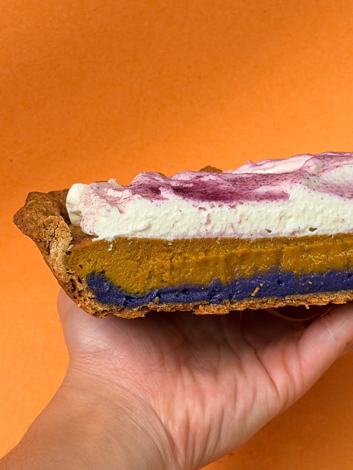 Spiced Ube Kalabasa Pie cross-section showing croissant crust, purple ube halaya, kalabasa, and mascarpone cream